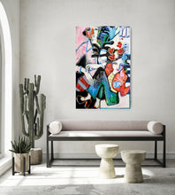 Load image into Gallery viewer, A colorful abstract canvas painting featuring stylized figures in red, blue, green, black, and white, displayed on a light gray wall above a modern bench in a styled living room setting.